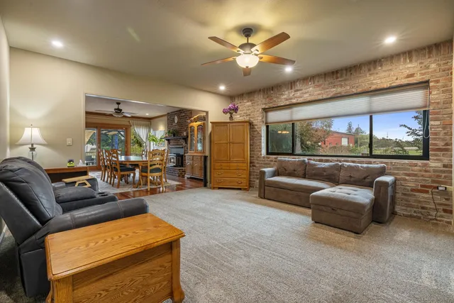 a view of hallway with wooden floor and stairs