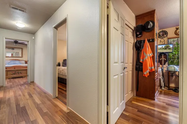 a bathroom with a granite countertop sink a toilet and a mirror