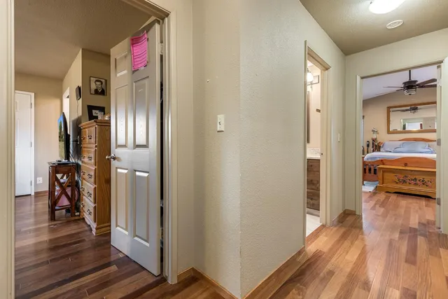 a view of walk in closet with clothes