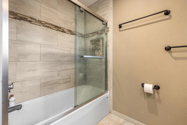 a bed room with bed and a large window