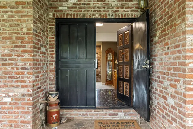 a kitchen with stainless steel appliances granite countertop a refrigerator and a stove