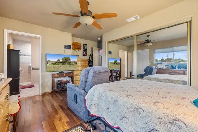 a view of a house with backyard and porch