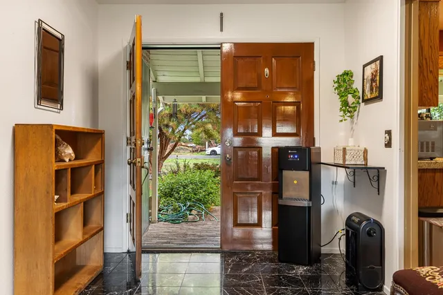 a kitchen with stainless steel appliances granite countertop sink stove top oven and cabinets