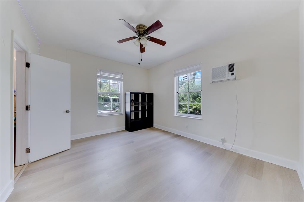 1241 13th Street, Unit 2 Miami Beach, FL 33139 - Photo 8 of 20 wooden floor in an empty room with a window