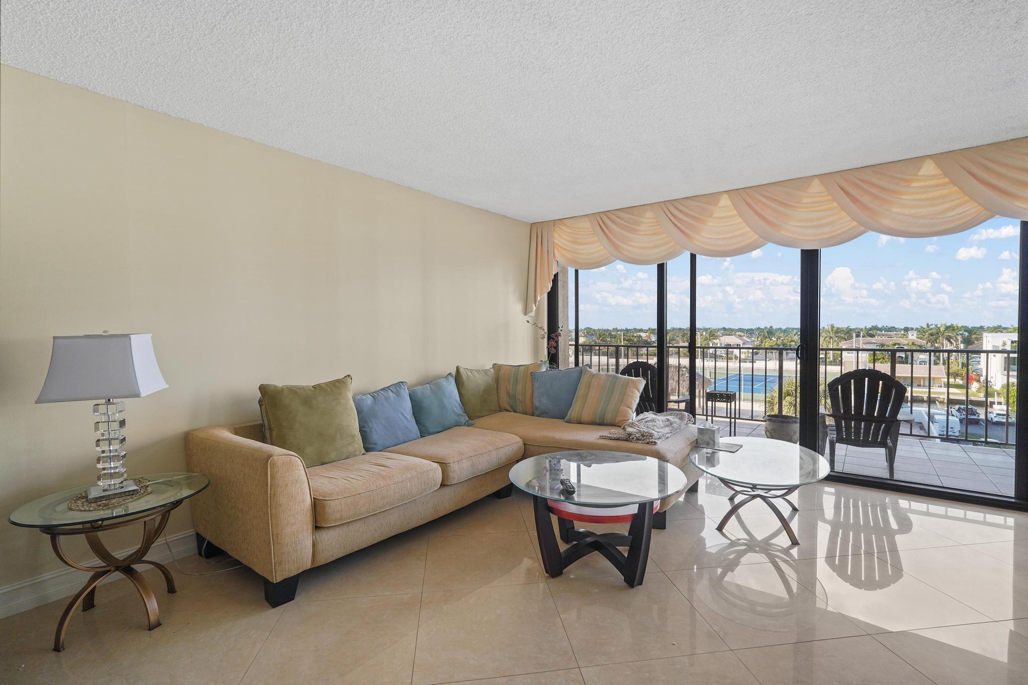 859 Jeffery Street, Unit 506 Boca Raton, FL 33487 - Photo 13 of 80 a living room with furniture and a floor to ceiling window