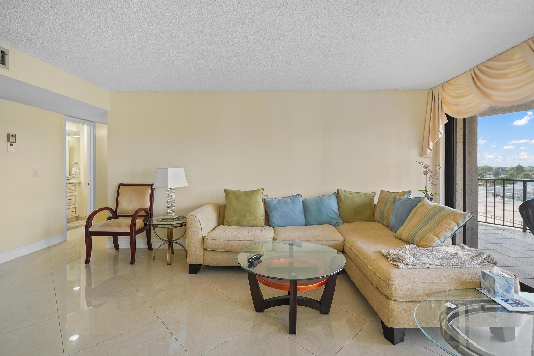 859 Jeffery Street, Unit 506 Boca Raton, FL 33487 - Photo 14 of 80 a living room with furniture and a couch