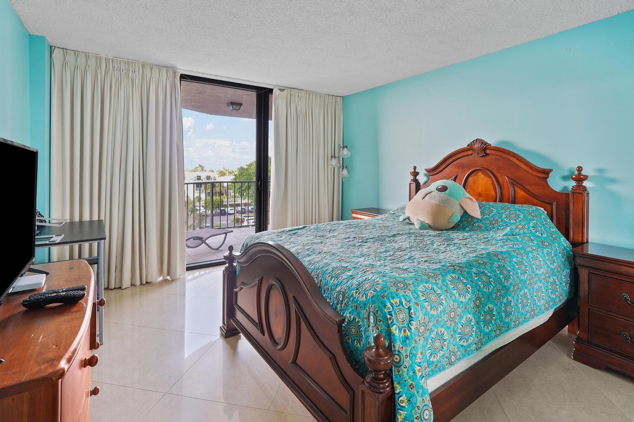 859 Jeffery Street, Unit 506 Boca Raton, FL 33487 - Photo 24 of 80 a bedroom with a bed and window