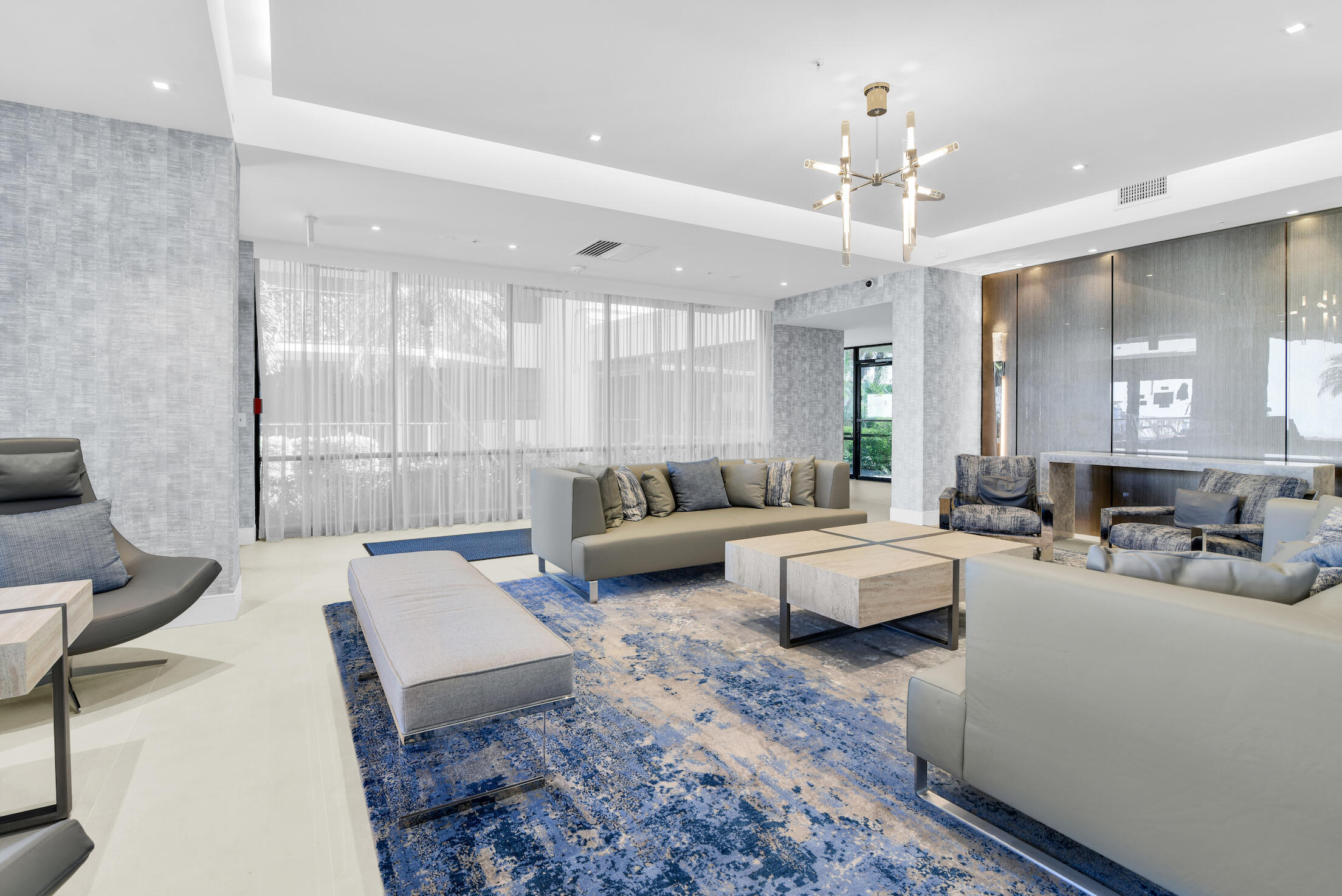 859 Jeffery Street, Unit 506 Boca Raton, FL 33487 - Photo 32 of 80 a living room with furniture and a chandelier