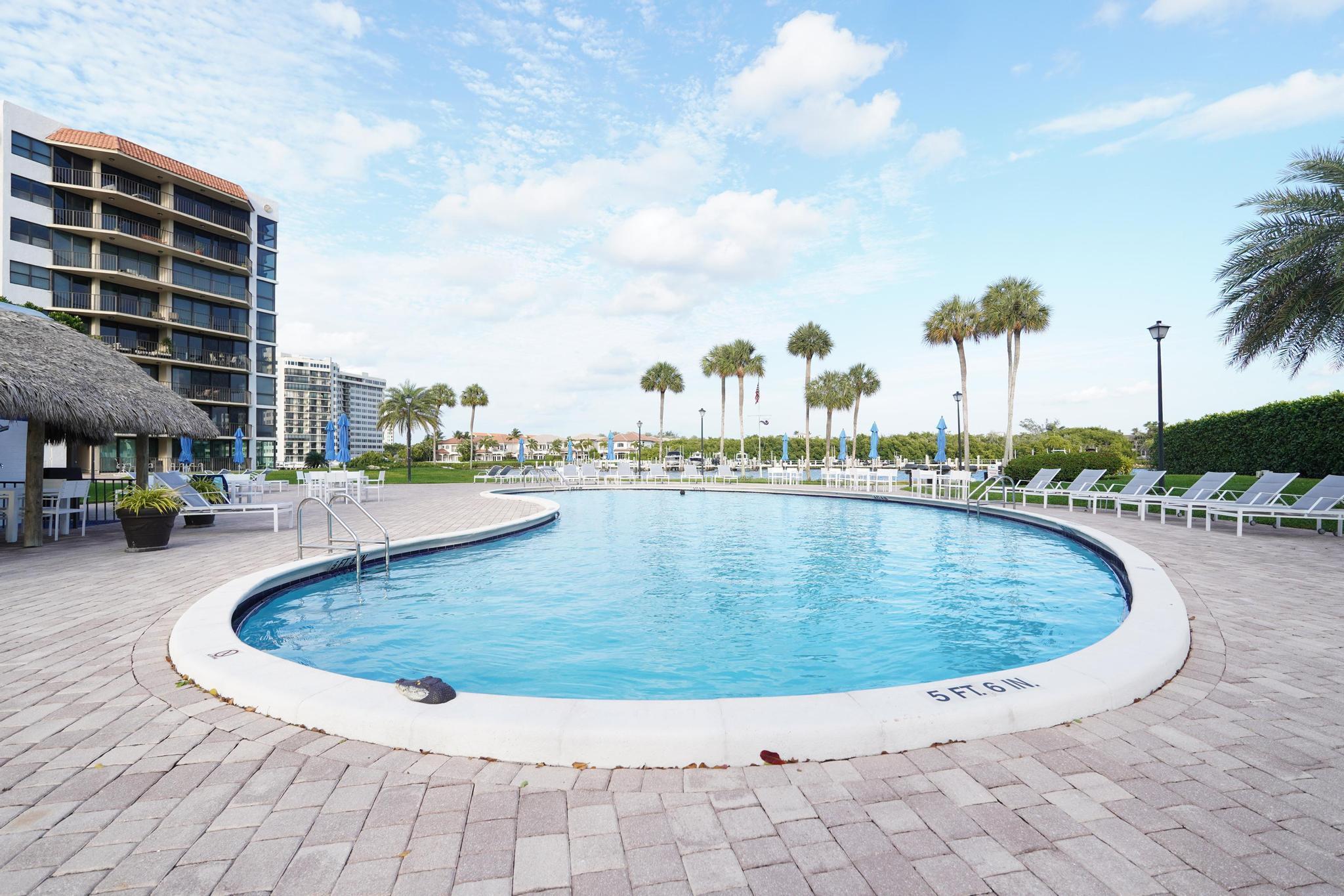 859 Jeffery Street, Unit 506 Boca Raton, FL 33487 - Photo 5 of 80 a view of outdoor space with swimming pool and seating