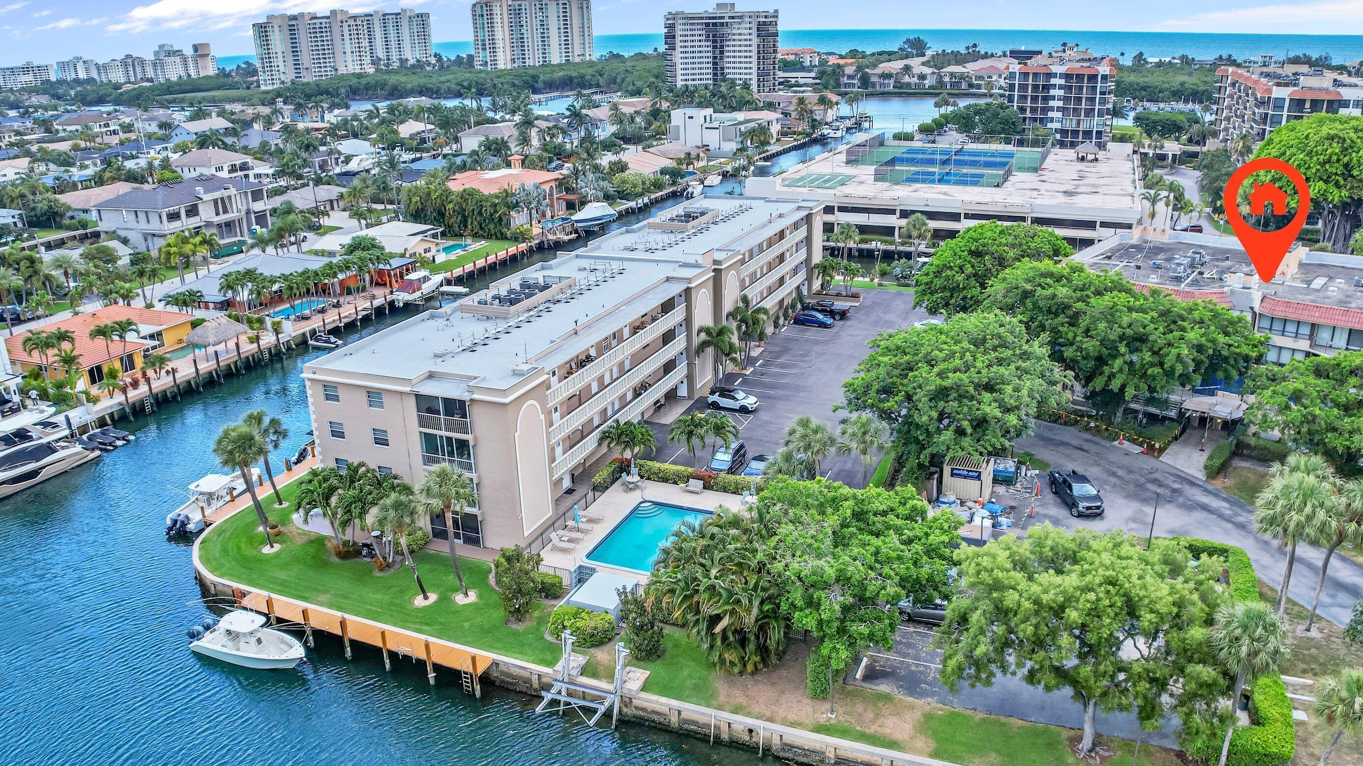 859 Jeffery Street, Unit 506 Boca Raton, FL 33487 - Photo 53 of 80 an aerial view of multiple houses with a yard