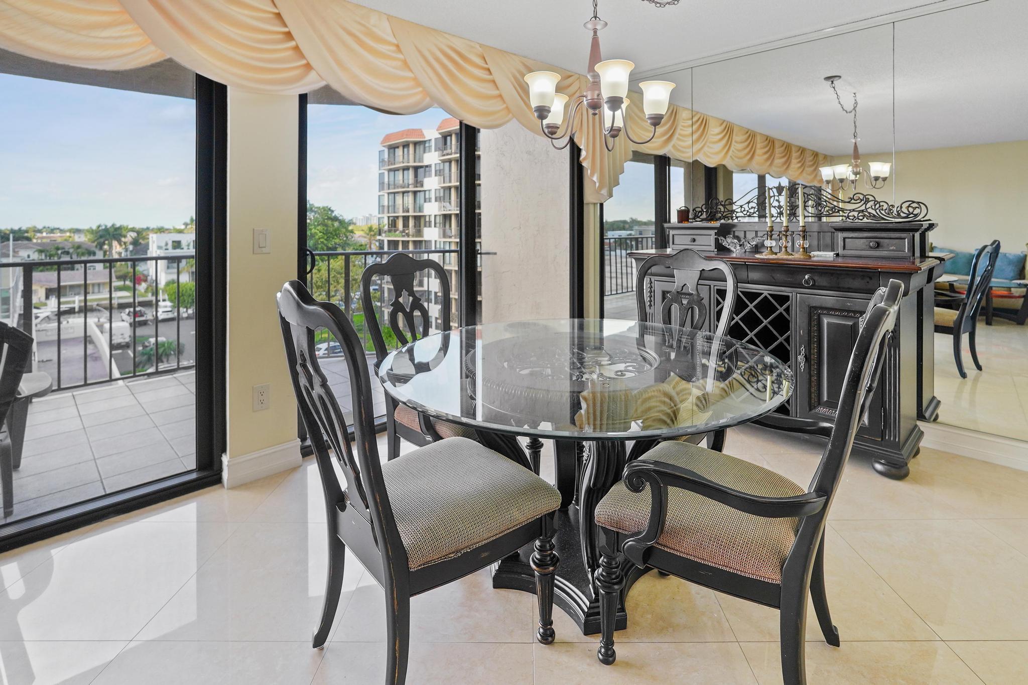 859 Jeffery Street, Unit 506 Boca Raton, FL 33487 - Photo 8 of 80 a view of a dining room with furniture window and outside view