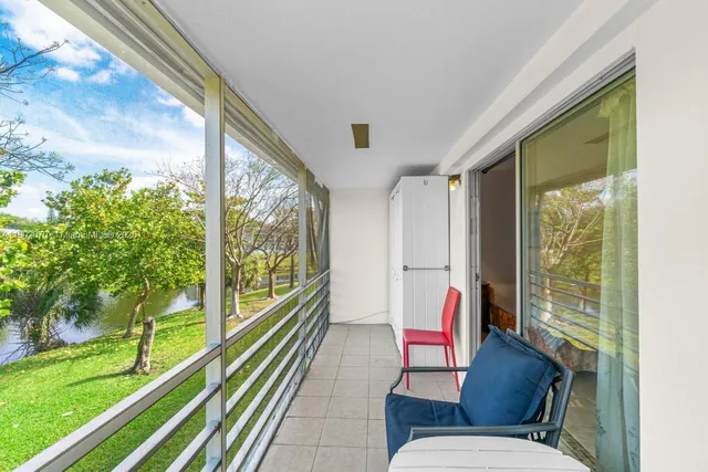 a bench sitting in front of a window