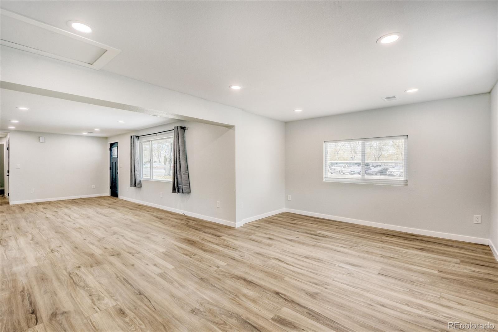 321 West Mulberry Street Fort Collins, CO 80521 - Photo 11 of 32 a view of an empty room with wooden floor and a window