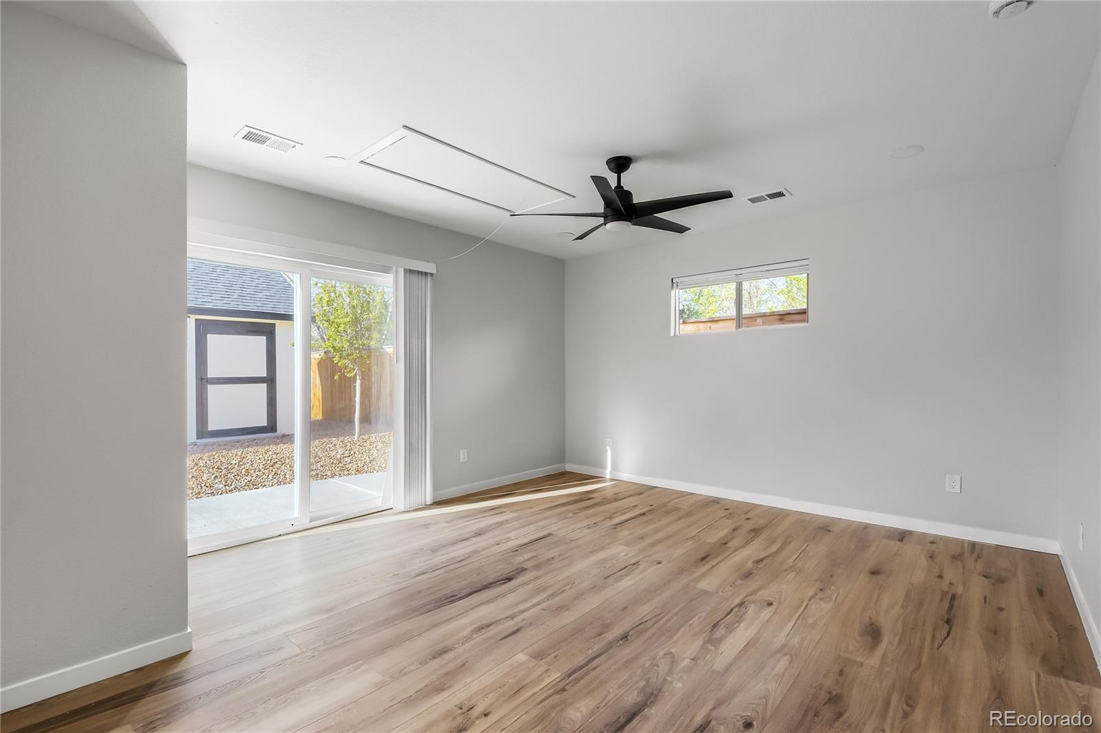 321 West Mulberry Street Fort Collins, CO 80521 - Photo 15 of 32 an empty room with wooden floor and windows
