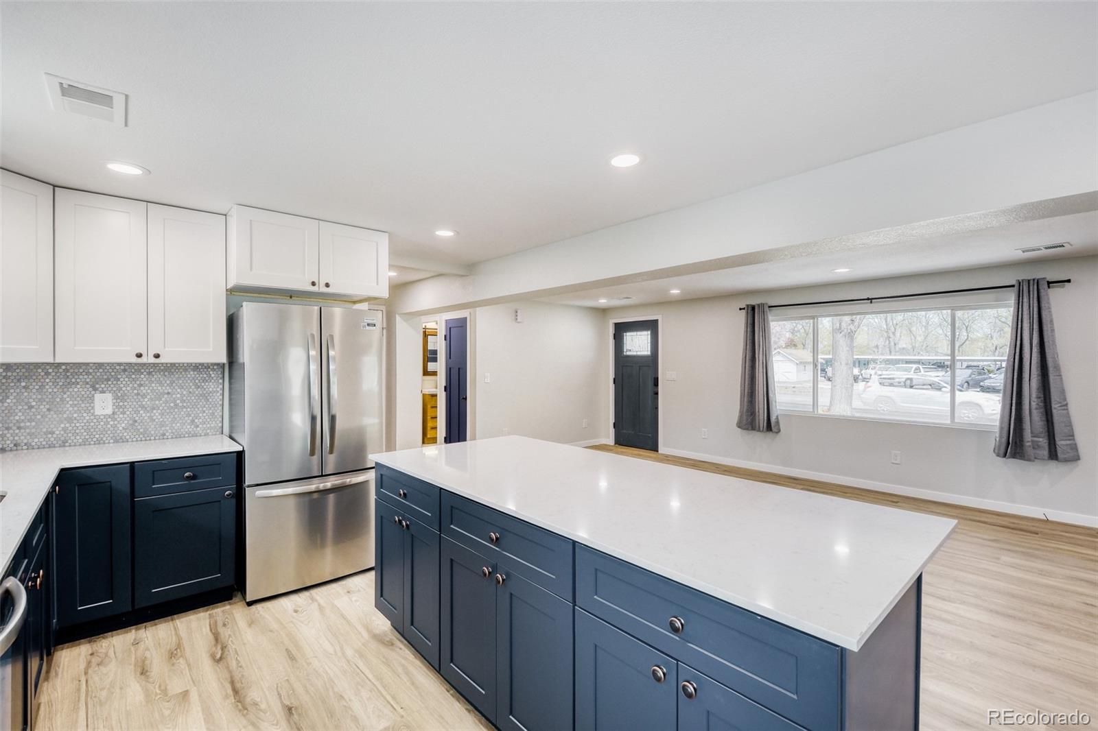 321 West Mulberry Street Fort Collins, CO 80521 - Photo 10 of 32 a kitchen with granite countertop a refrigerator and a sink