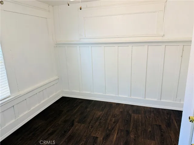 a view of small space with wooden floor and sink