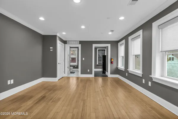 a kitchen with stainless steel appliances granite countertop a sink stove and microwave