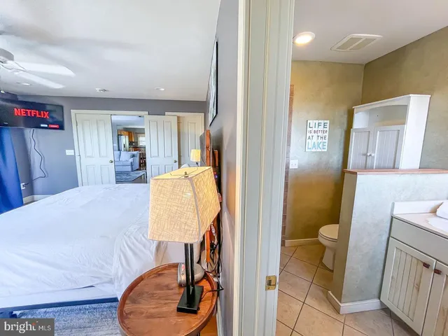 a bedroom with a bed and a couch