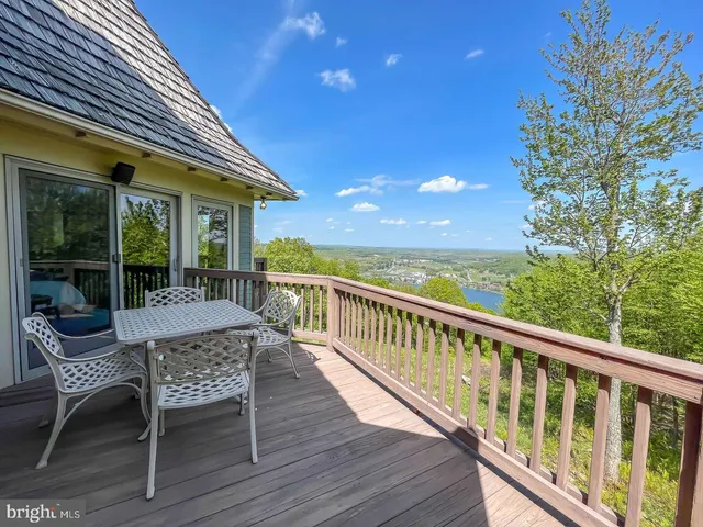 a view of a chair and table in the balcony
