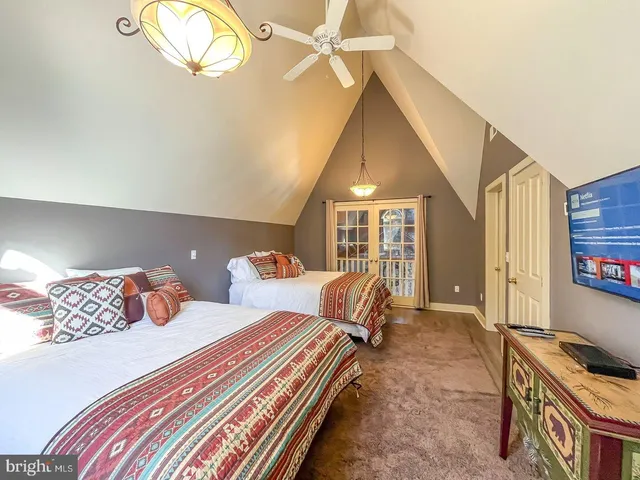 a bedroom with bed and a window