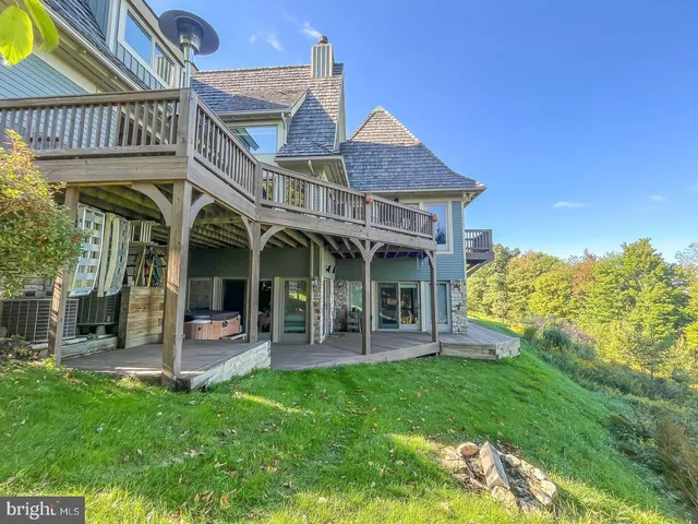 a view of a house with a yard porch and sitting area