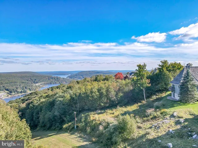 a view of a lake with a yard