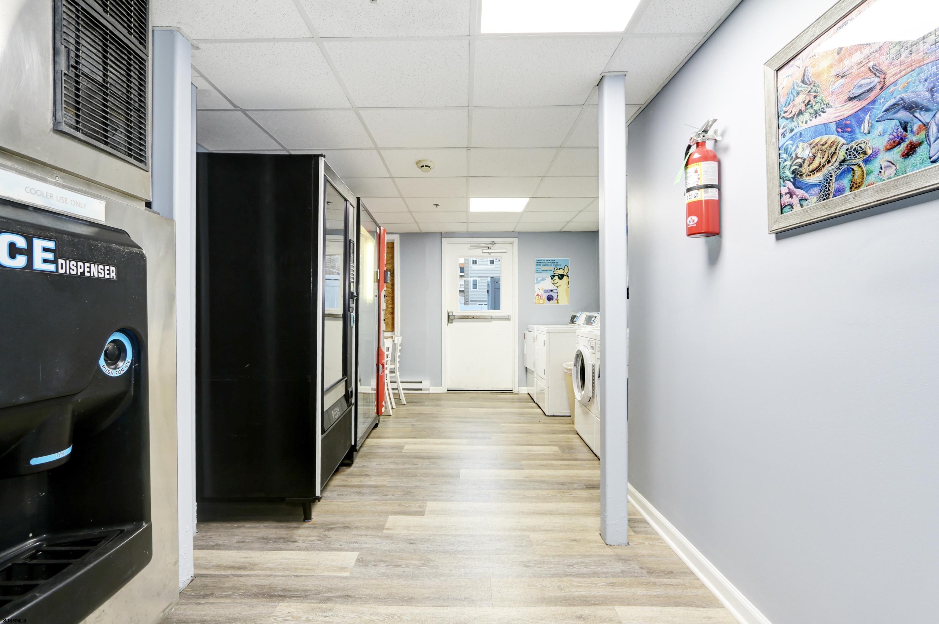 807 East 8th Street, Unit 515 Ocean City, NJ 08226 - Photo 17 of 34 a view of hallway with furniture and refrigerator