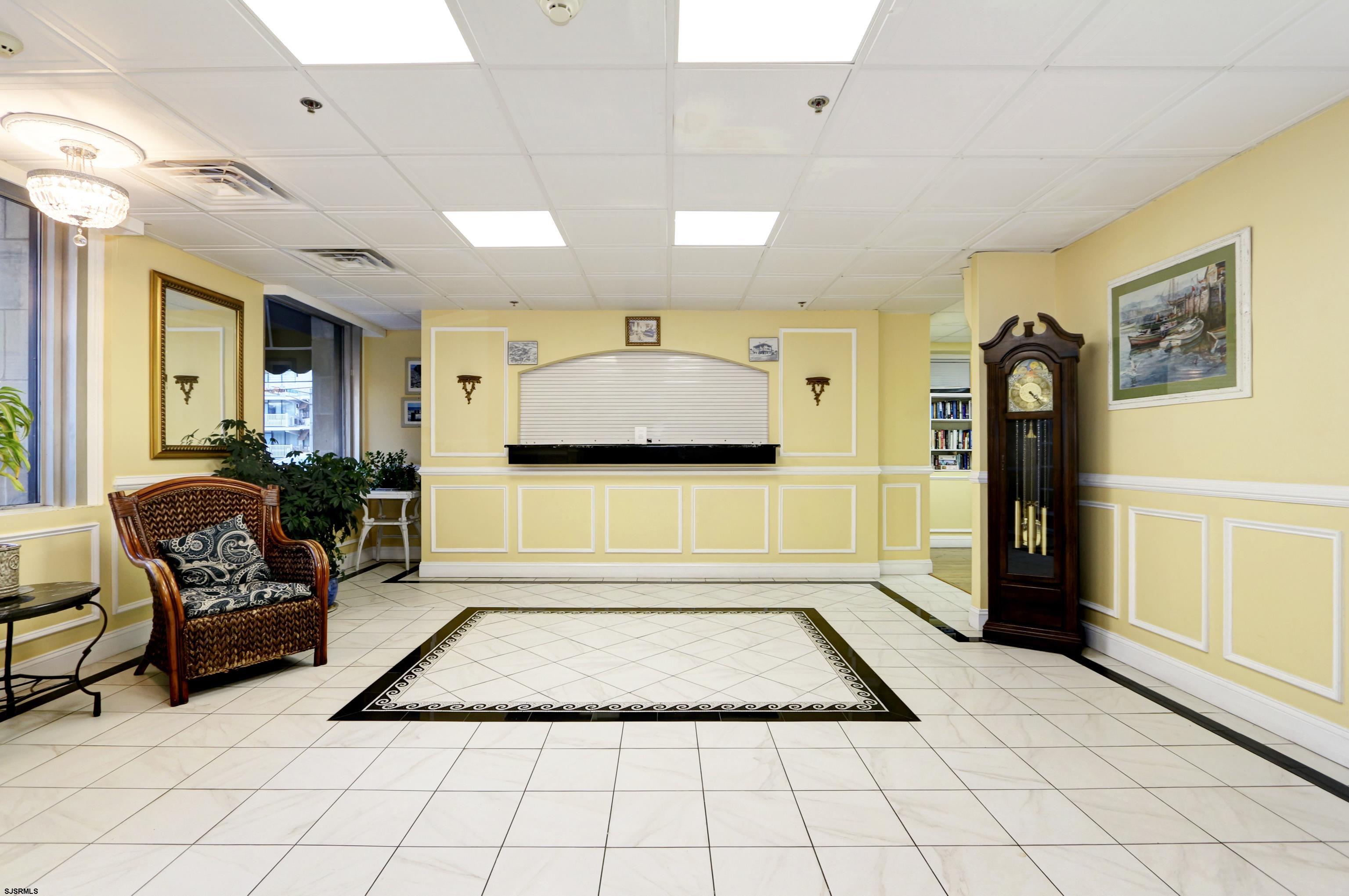 807 East 8th Street, Unit 515 Ocean City, NJ 08226 - Photo 21 of 34 a living room with furniture and a rug