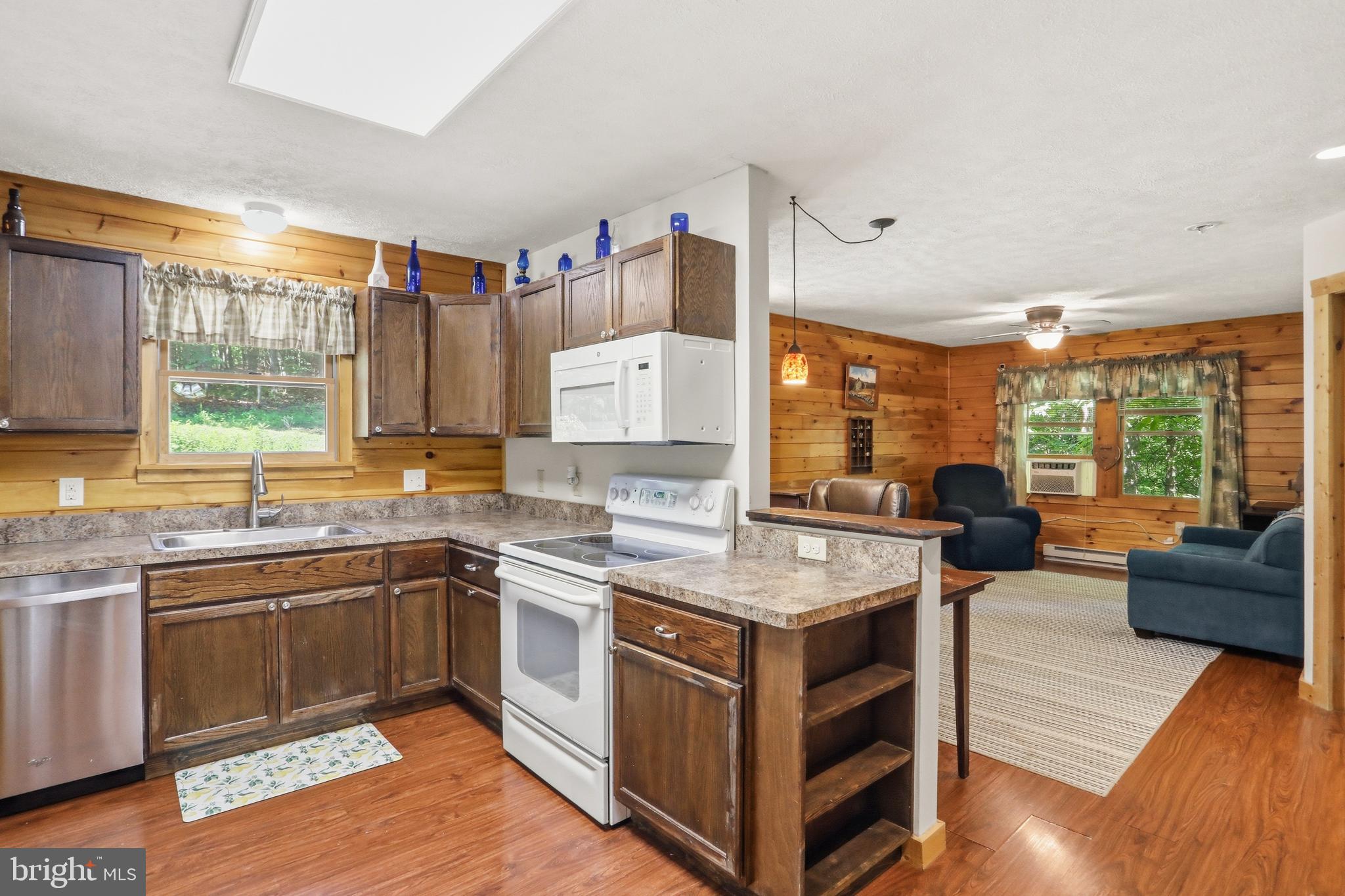 1400 Core Road Romney, WV 26757 - Photo 45 of 73 a open kitchen with stainless steel appliances granite countertop a stove and cabinets
