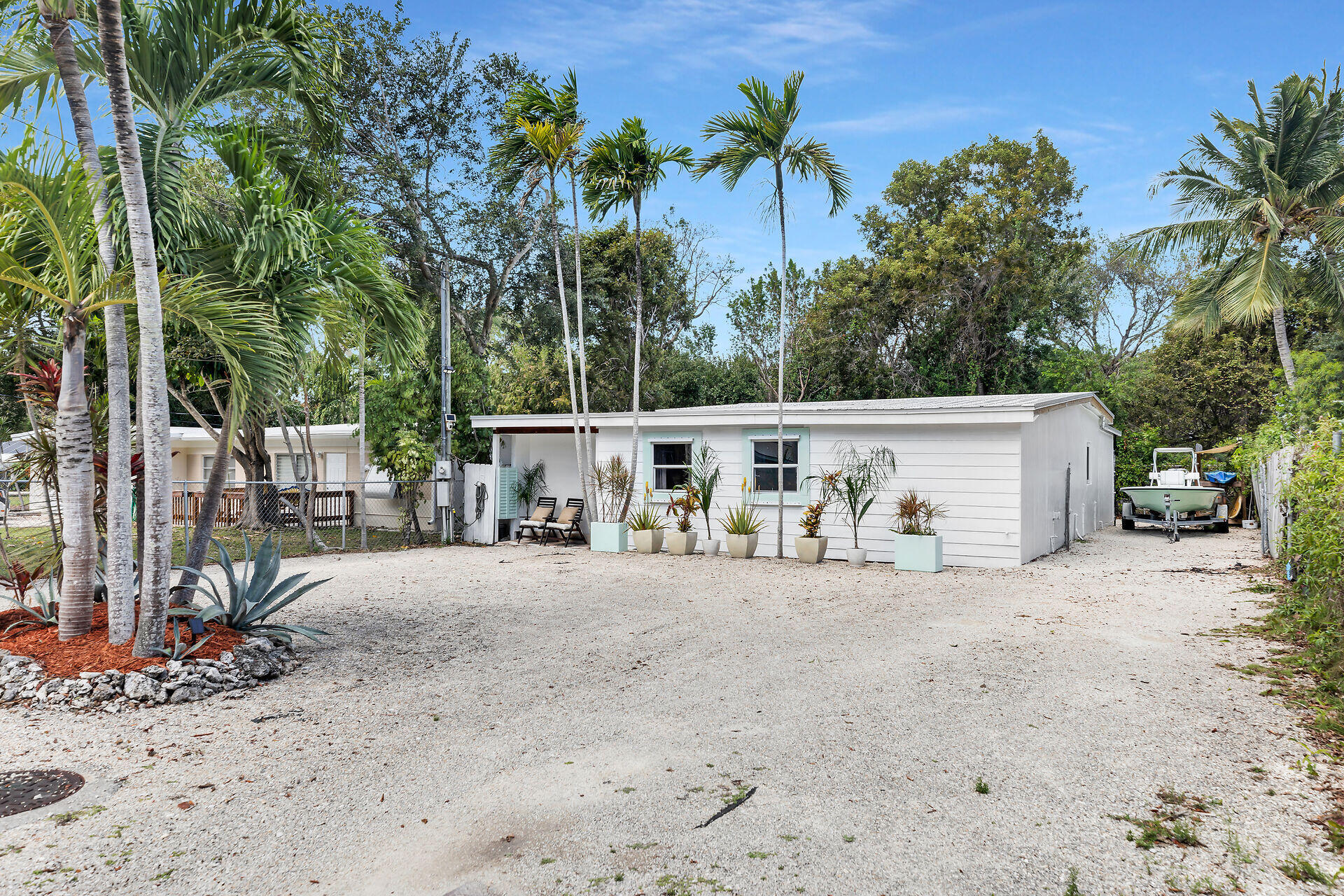 10 Dolphin Road Key Largo, FL 33037 - Photo 44 of 55 a view of a house with a patio