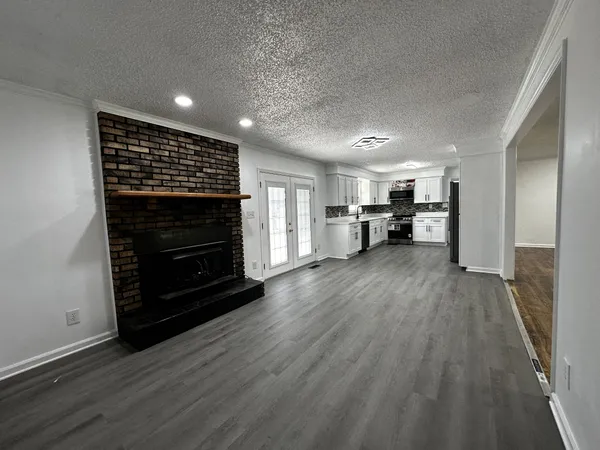 a view of kitchen with furniture and wooden floor