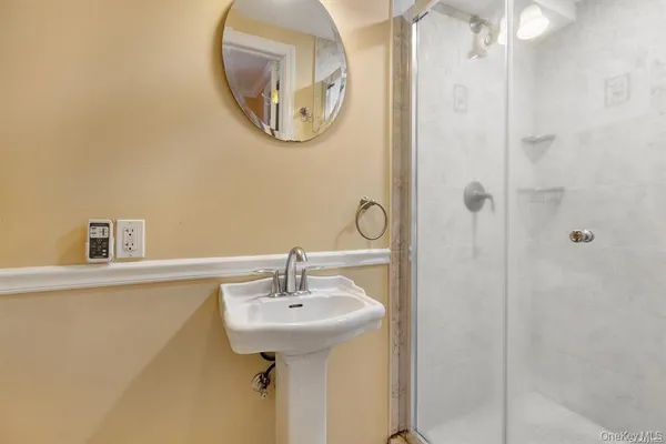 a bathroom with a sink and a mirror
