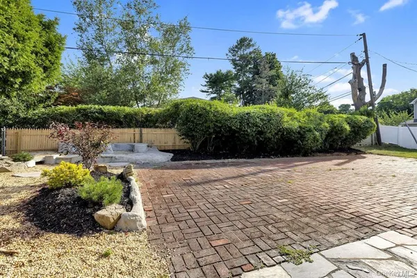 a view of a backyard with potted plants
