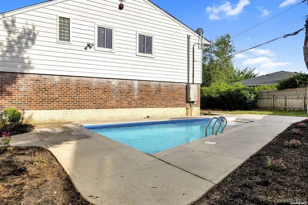 a view of a backyard with a patio