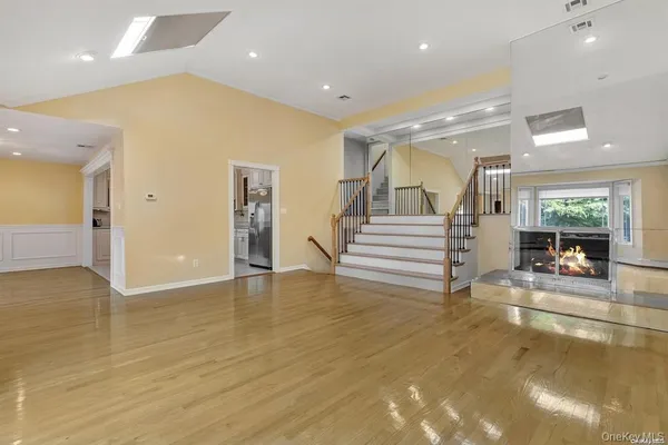 a view of an entryway with wooden floor