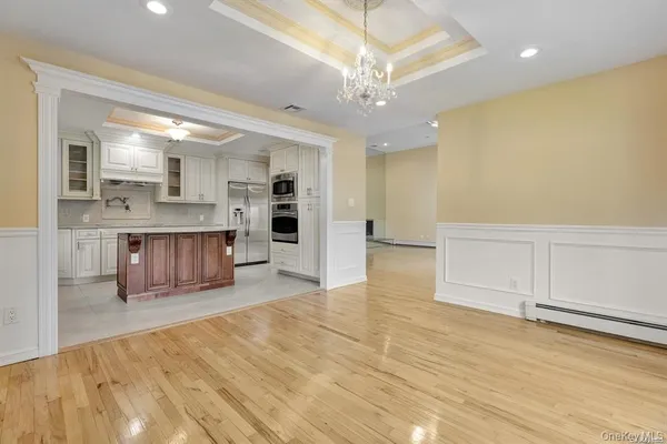 a large room with wooden floor and windows