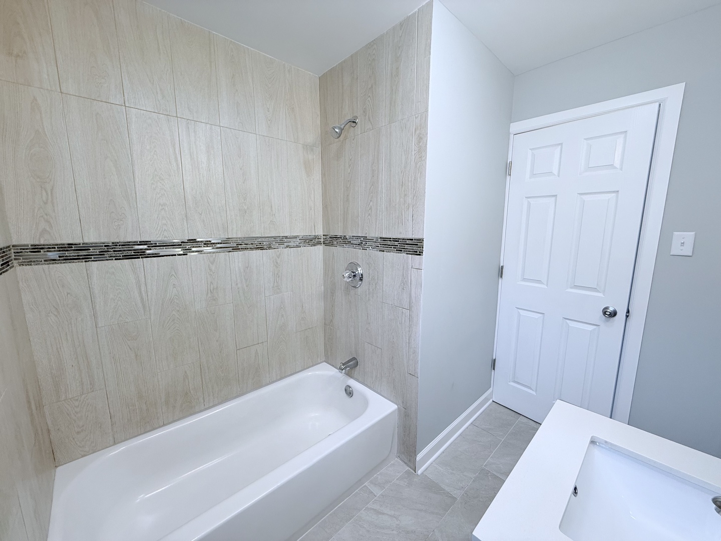 2658 West 83rd Street Chicago, IL 60652 - Photo 12 of 37 a bathroom with a tub a sink and a shower