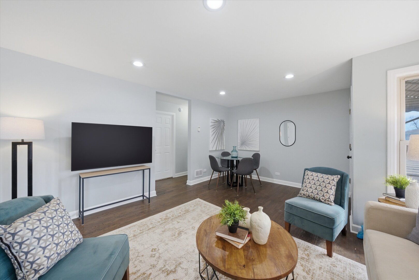 2658 West 83rd Street Chicago, IL 60652 - Photo 5 of 37 a living room with furniture and a flat screen tv