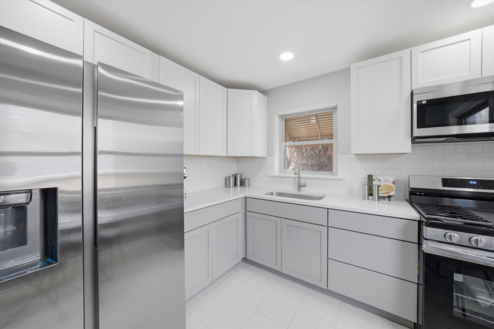 2658 West 83rd Street Chicago, IL 60652 - Photo 9 of 37 a kitchen with a sink stainless steel appliances and cabinets