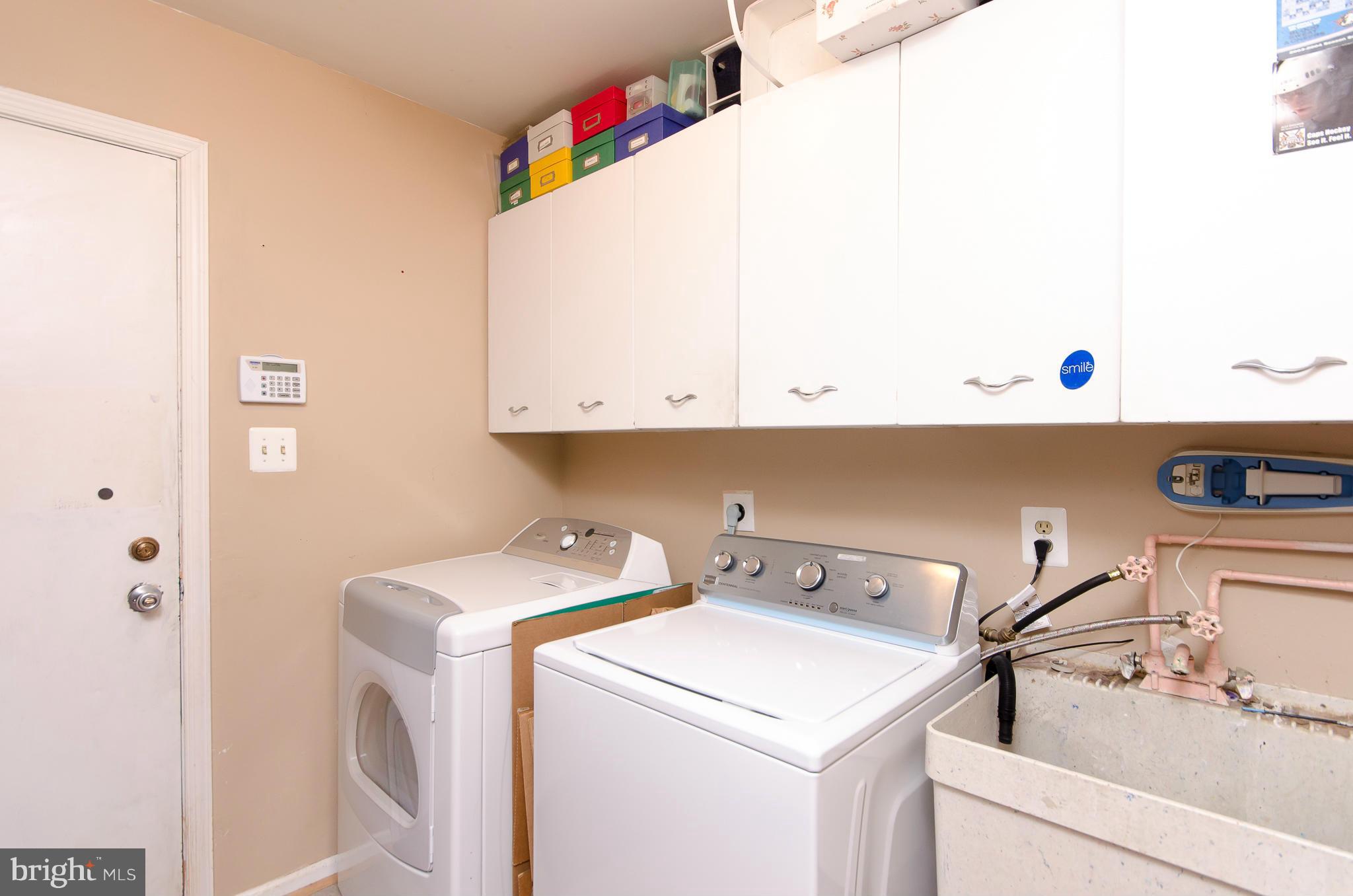 8402 Riverside Road Alexandria, VA 22308 - Photo 12 of 29 a utility room with dryer and washer
