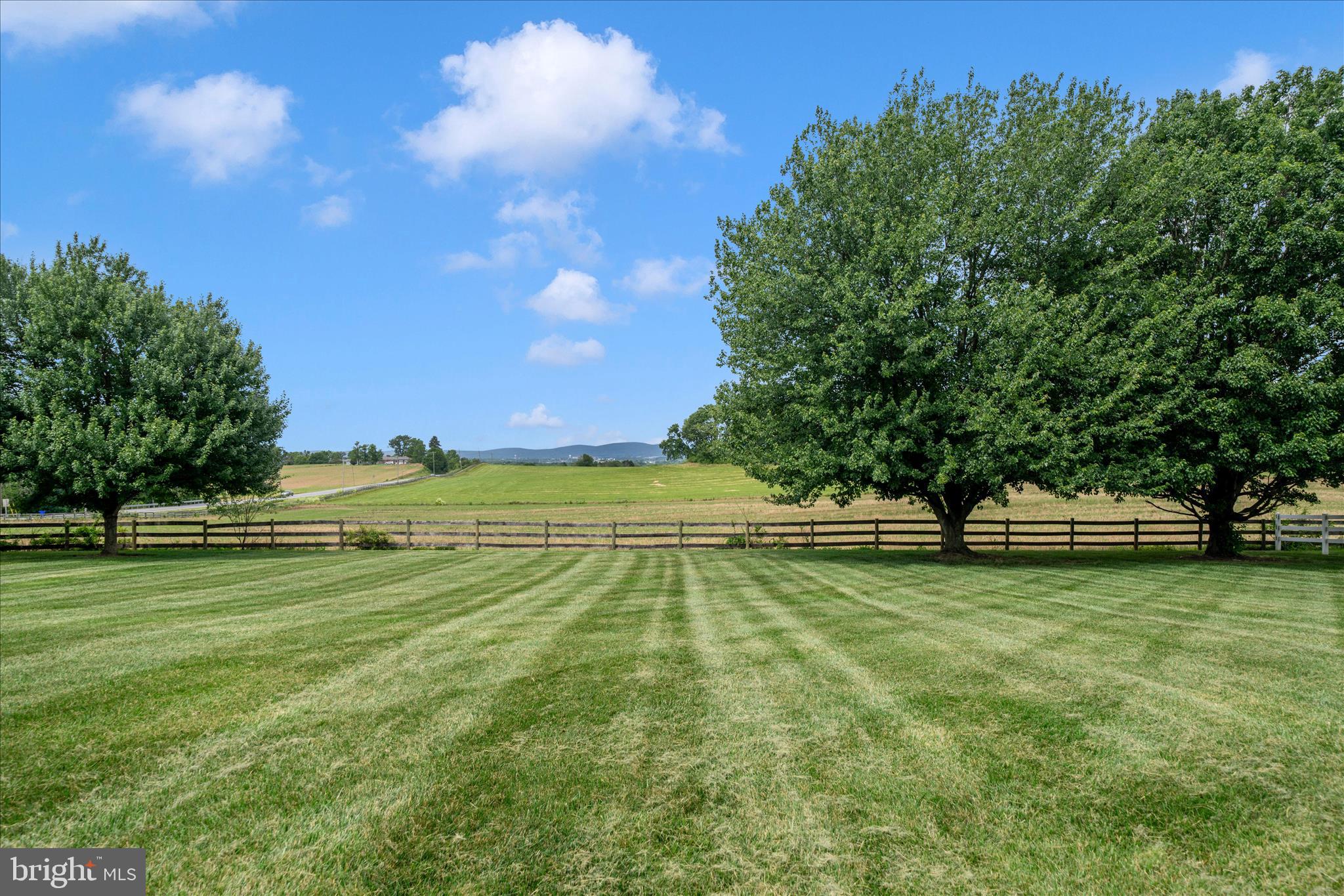 9534 Liberty Road Frederick, MD 21701 - Photo 60 of 70 a view of a golf course with a lake