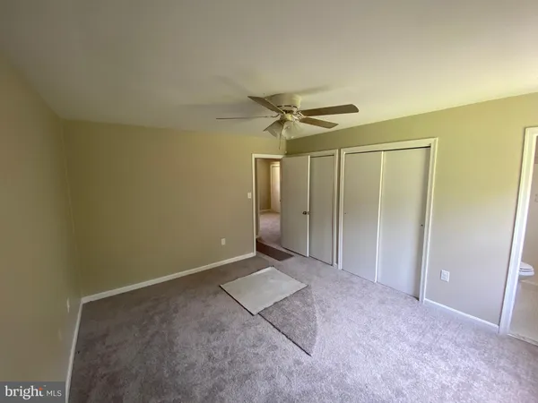 a bathroom with a sink mirror and vanity
