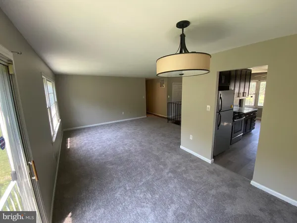 a view of a hallway with a washer and dryer