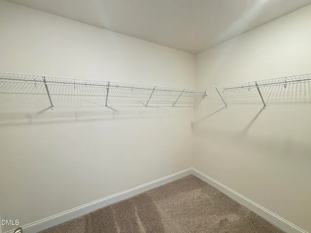 a spacious bathroom with a granite countertop sink a mirror a shower and a bathtub