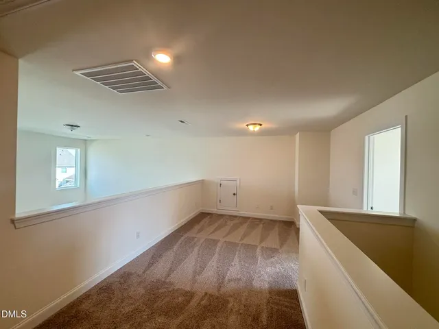 a view of a room with racks on the wall