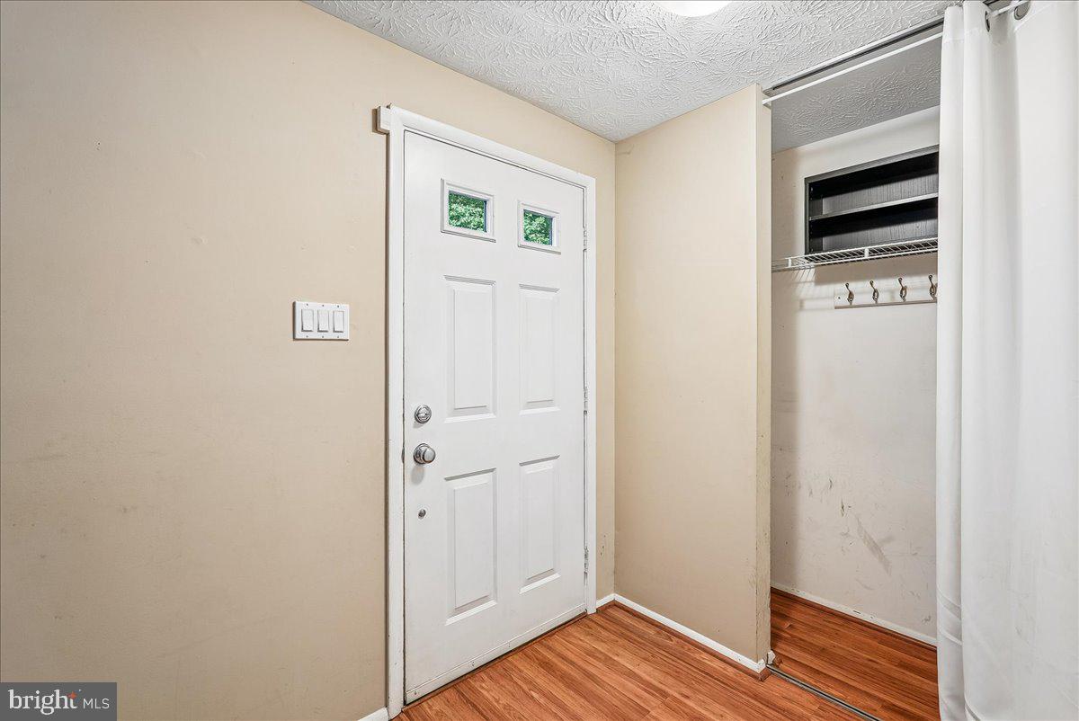 2331 Middle Creek Lane Reston, VA 20191 - Photo 10 of 78 a view of walk in closet with wooden floor