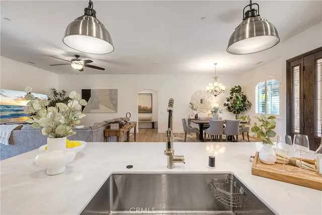 a view of living room with furniture and a chandelier