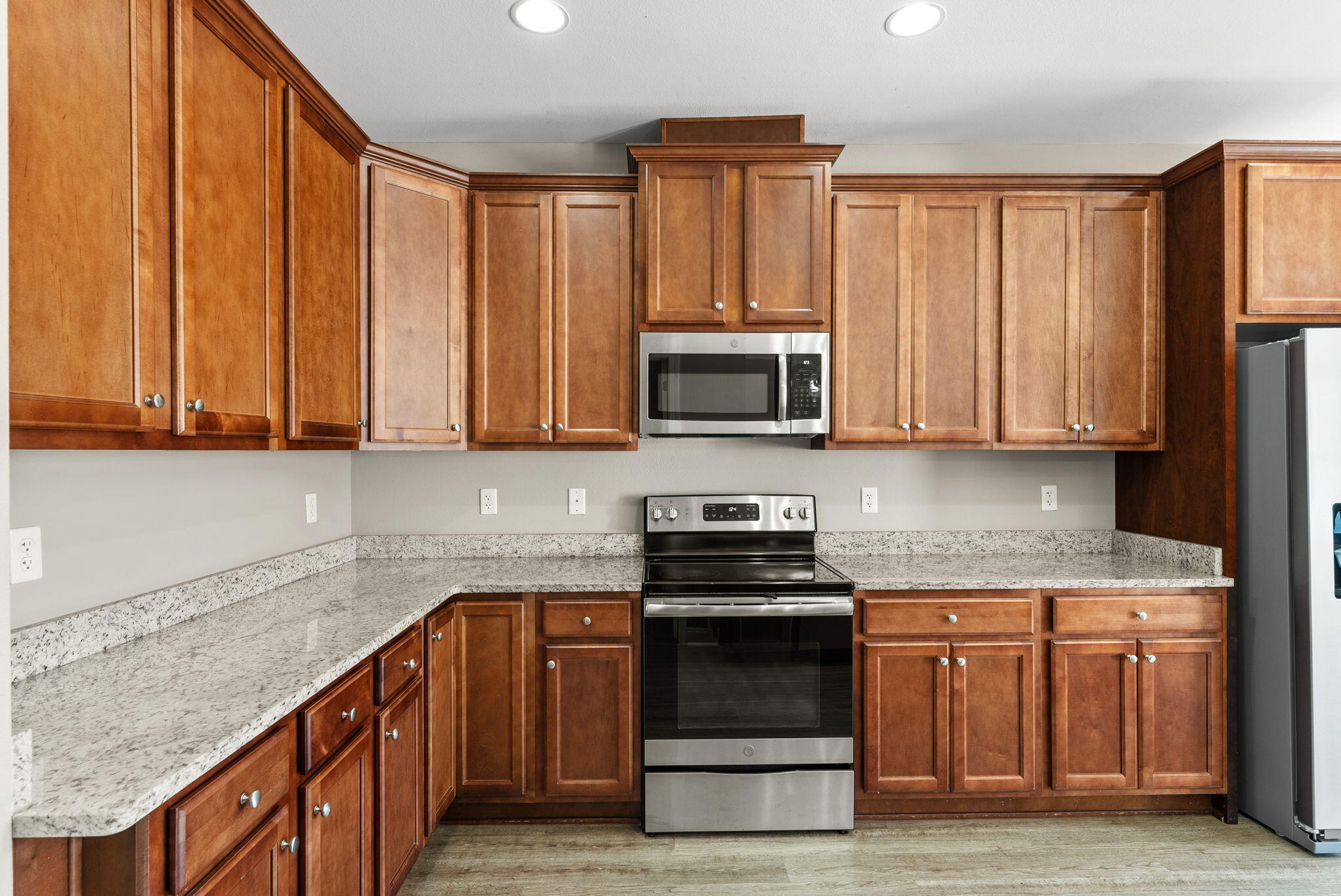 266 Partridge Lane Freeport, FL 32439 - Photo 12 of 36 a kitchen with stainless steel appliances granite countertop a stove a sink and a microwave