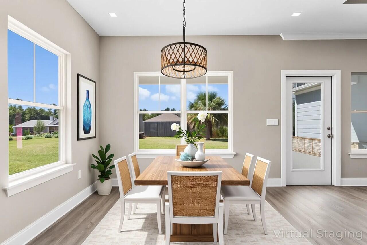 266 Partridge Lane Freeport, FL 32439 - Photo 16 of 36 a dining room with furniture window and wooden floor