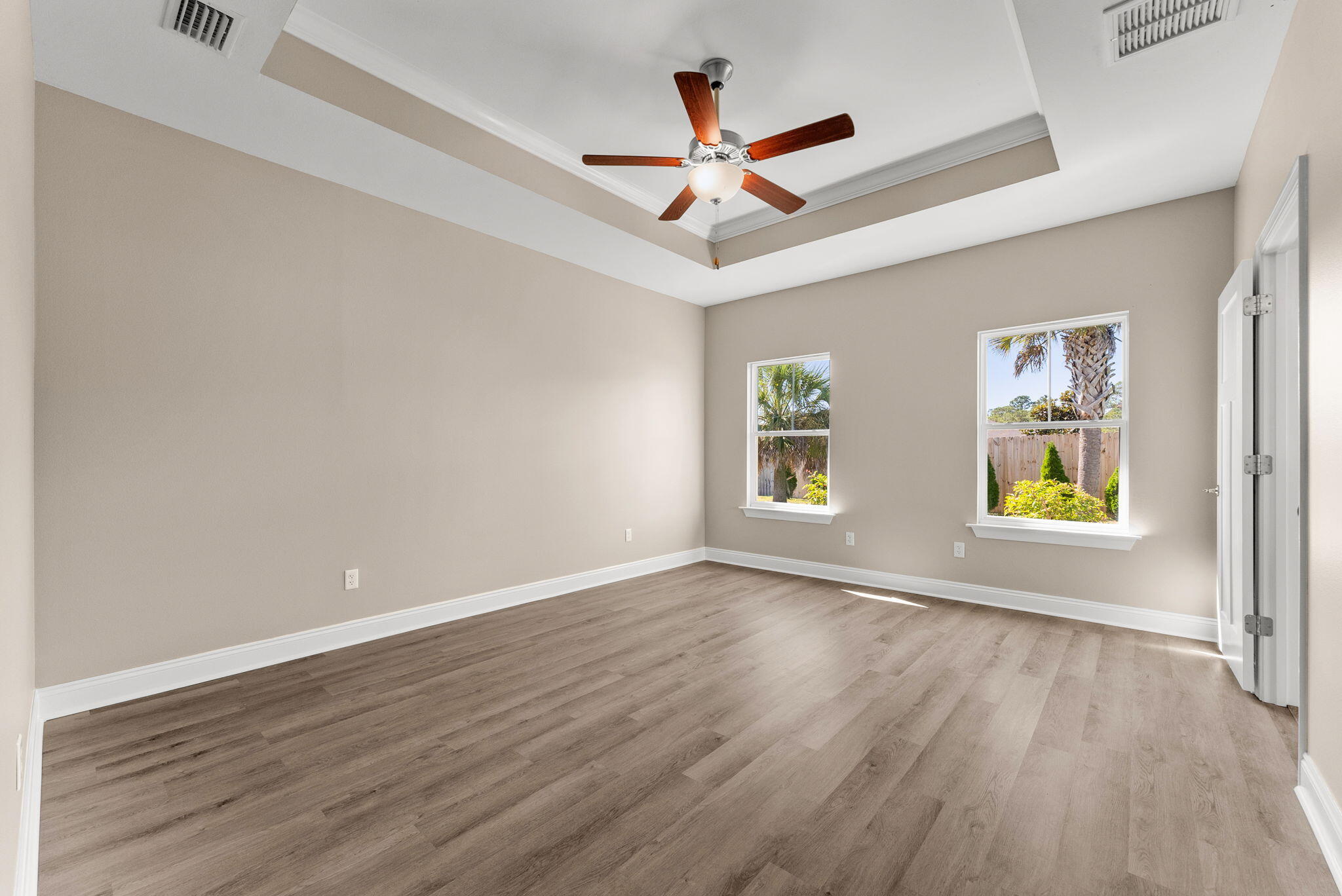 266 Partridge Lane Freeport, FL 32439 - Photo 17 of 36 a view of an empty room with window and wooden floor